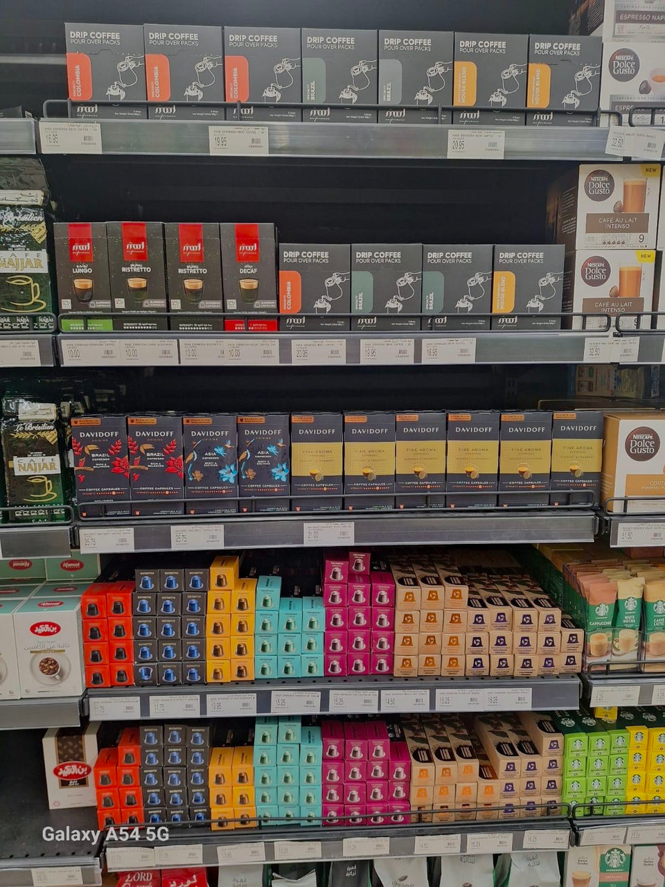 Mood Espresso drip coffee packs and capsules displayed in a supermarket